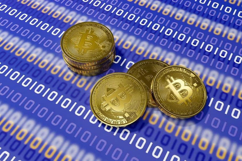 蓝色背景上的比特币与白色二进制代码。