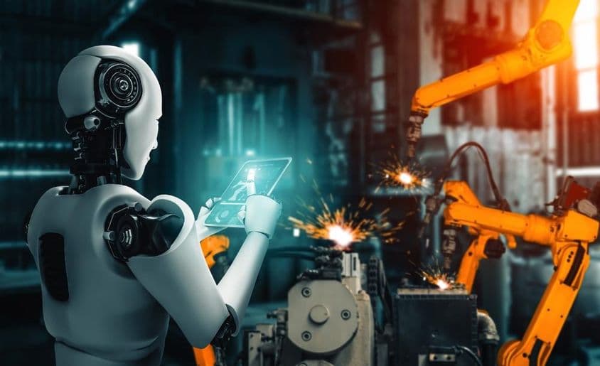 人工智能在生产线上监控机器人手臂的组装过程。