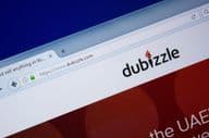 Dubizzle网站首页在电脑显示器上的展示,网址 - Dubizzle.com。